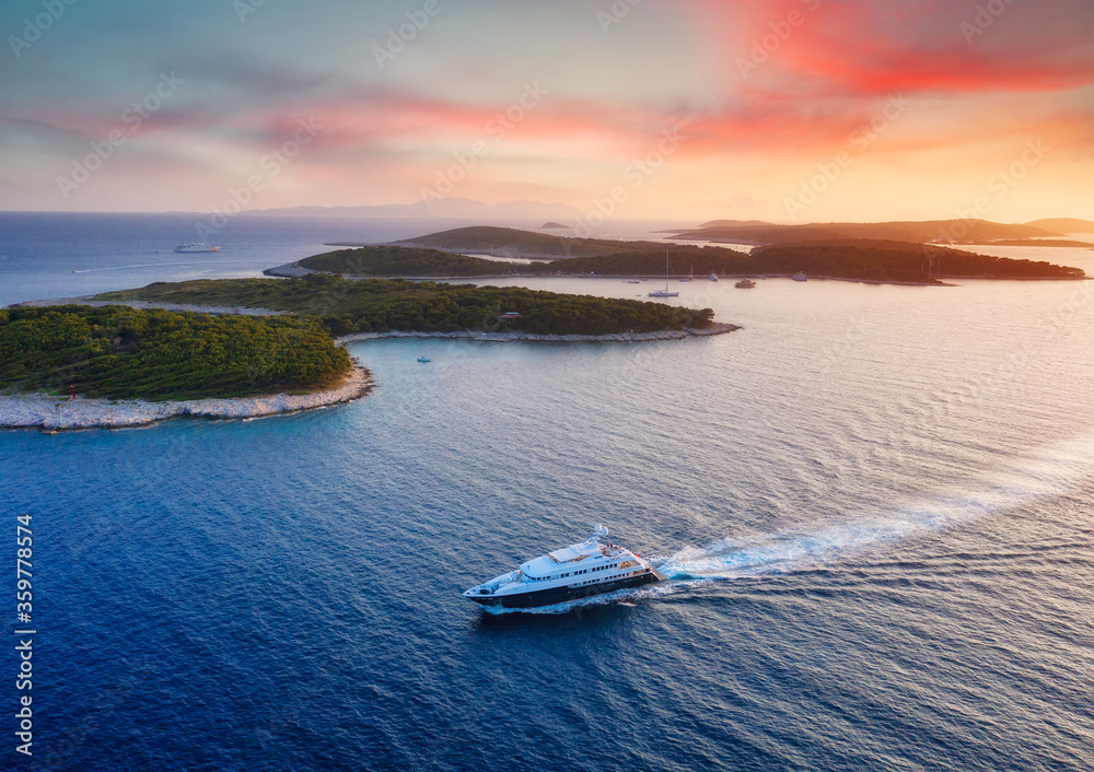 Aerial view on the luxury yacht during sunset. Adventure and travel.  Landscape with ship on Adriati