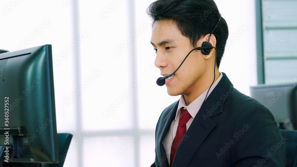 Business people wearing headset working in office to support remote customer or colleague. Call cent