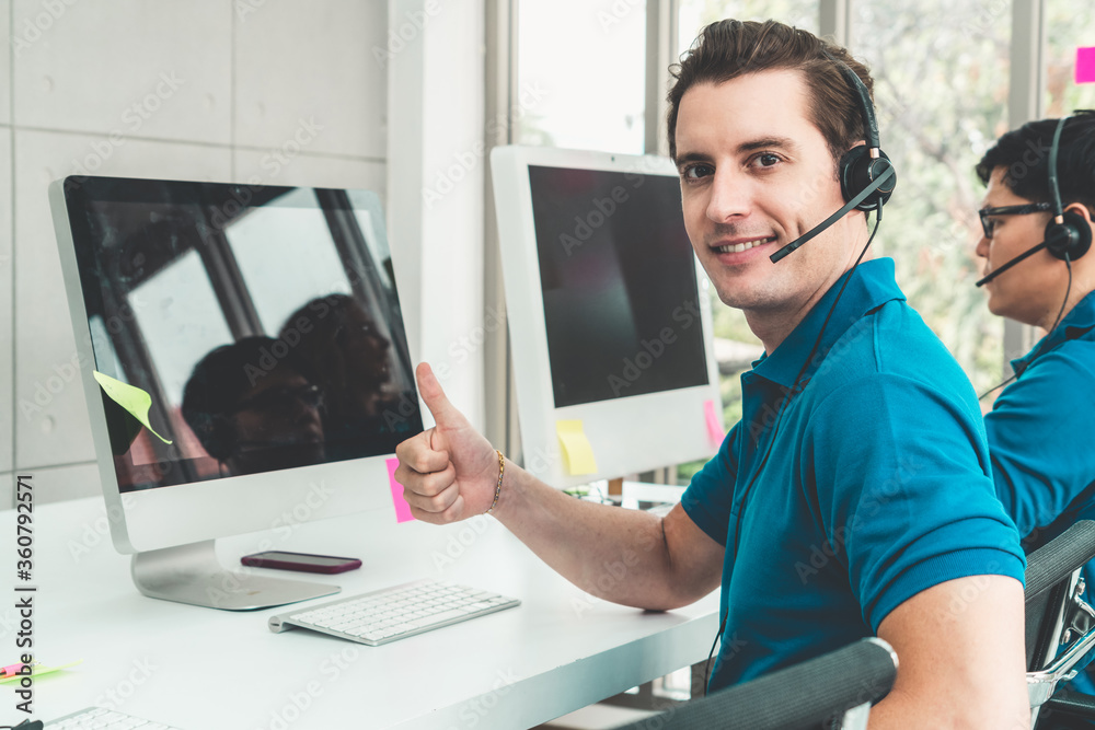 Business people wearing headset working in office to support remote customer or colleague. Call cent