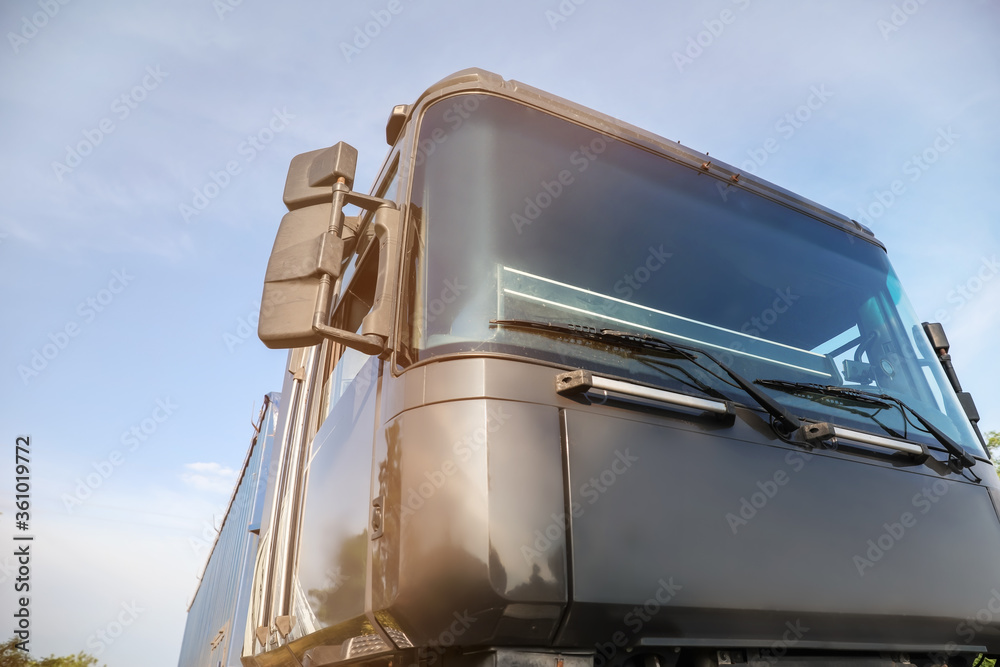 Big modern truck against blue sky