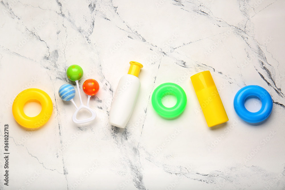 Sunscreen cream with toys on white background