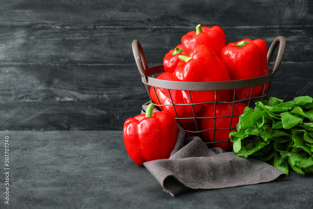 Basket with red bell pepper on table