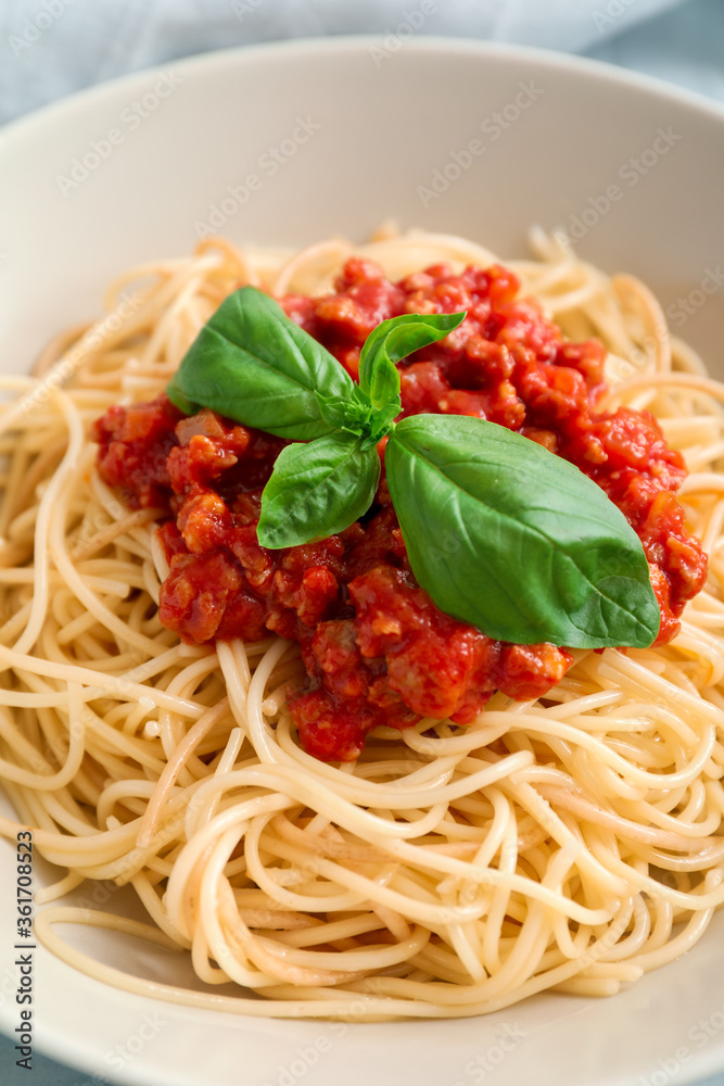 Plate with tasty pasta bolognese, closeup