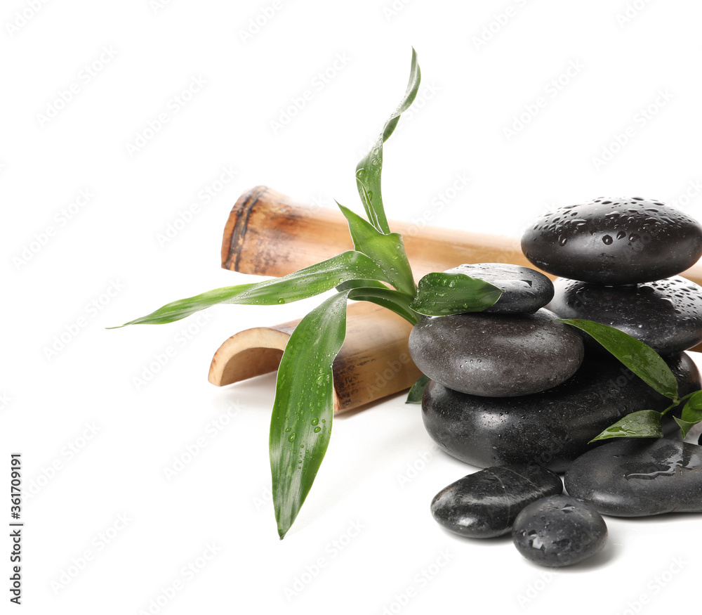 Spa stones and bamboo on white background