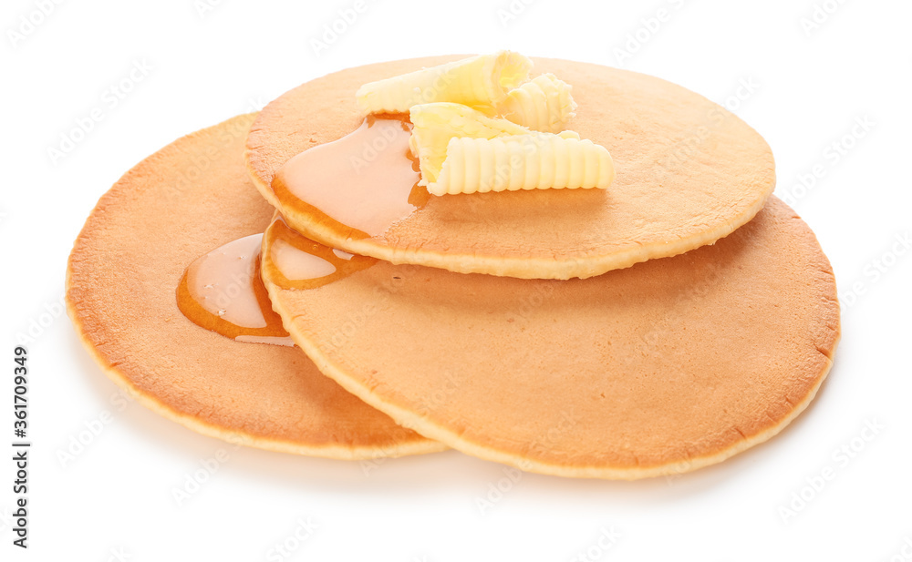 Tasty pancakes with honey and butter on white background