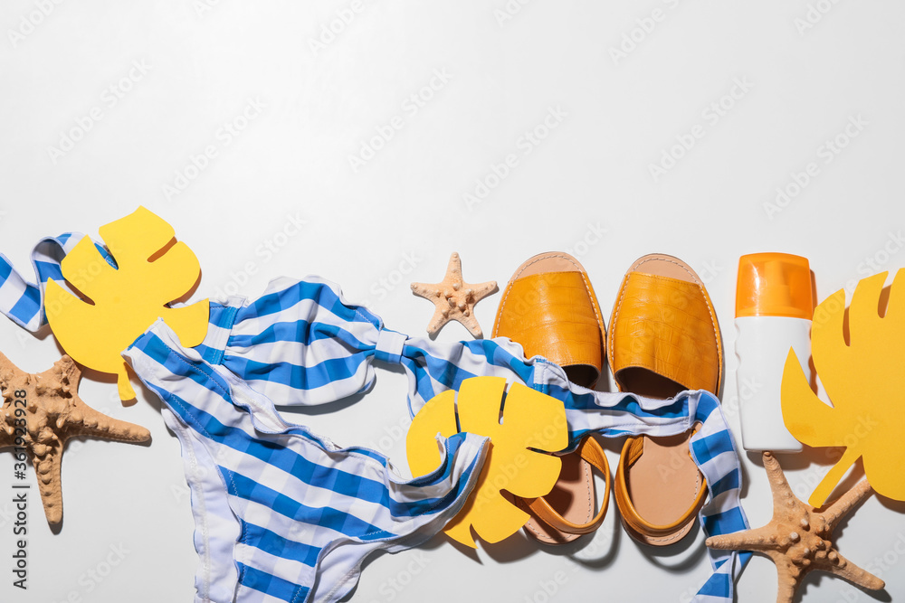 Composition with beach accessories on white background