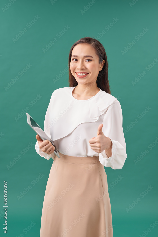 Successful elegant businesswoman using digital tablet