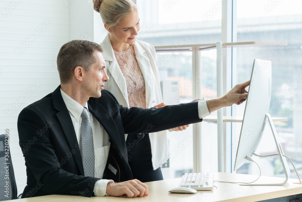 Two business people talk project strategy at office meeting room. Businessman discuss project planni