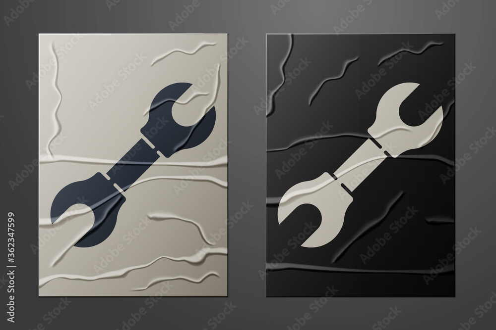 White Wrench spanner icon isolated on crumpled paper background. Paper art style. Vector Illustratio