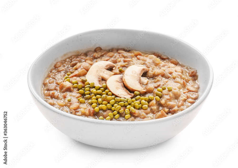 Bowl of tasty lentils soup on white background