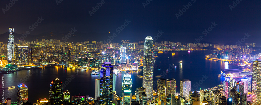 Aerial panoramic view of Hong Kong Island and Kowloon at night, Hong Kong city at night from the Vic