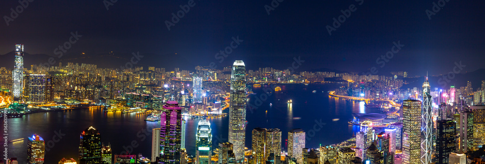 Aerial panoramic view of Hong Kong Island and Kowloon at night, Hong Kong city at night from the Vic