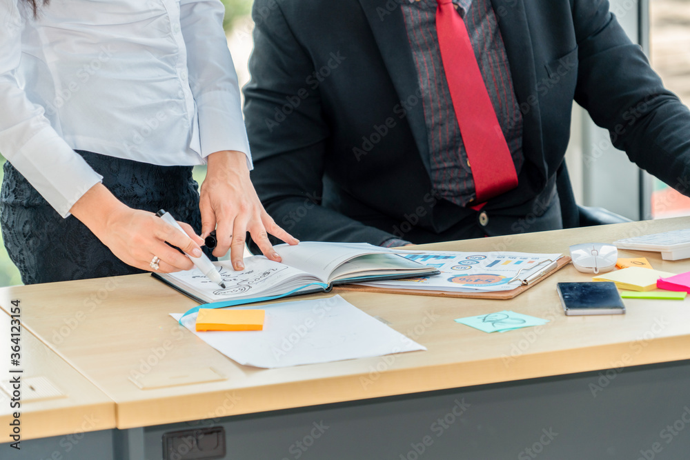 Two business people talk project strategy at office meeting room. Businessman discuss project planni