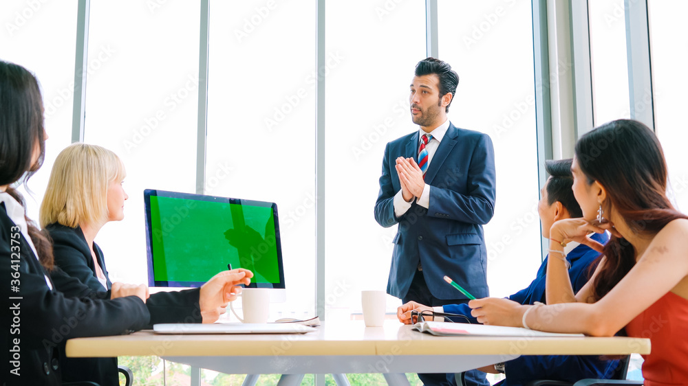 Business people in the conference room with green screen chroma key TV or computer on the office tab