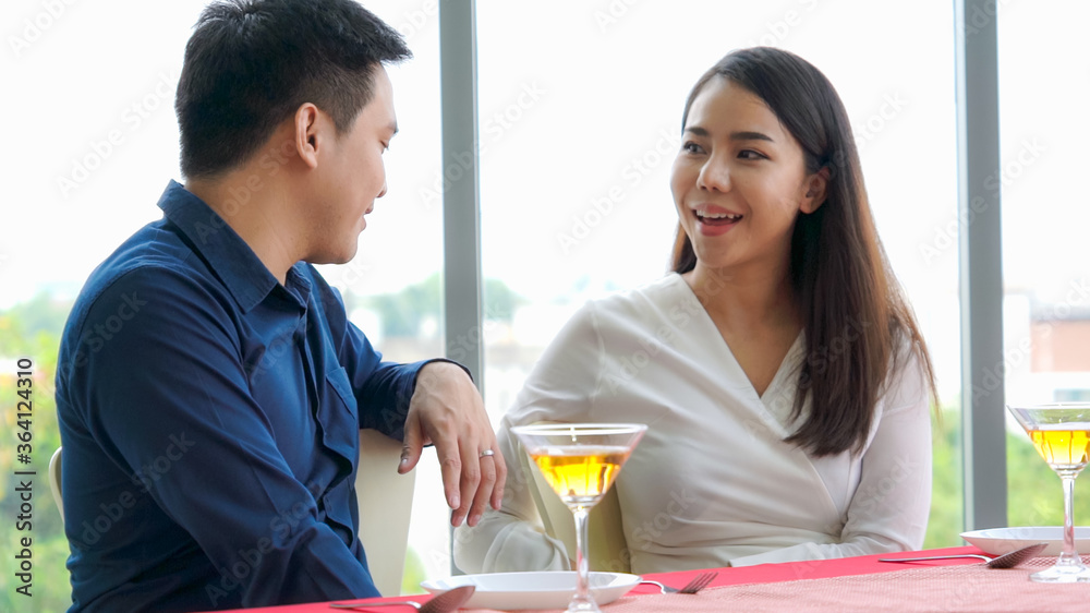 Happy romantic couple eating lunch at restaurant . Couple anniversary celebration and lifestyle .