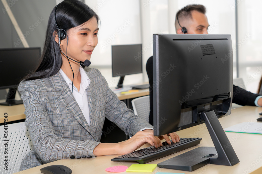 Business people wearing headset working in office to support remote customer or colleague. Call cent