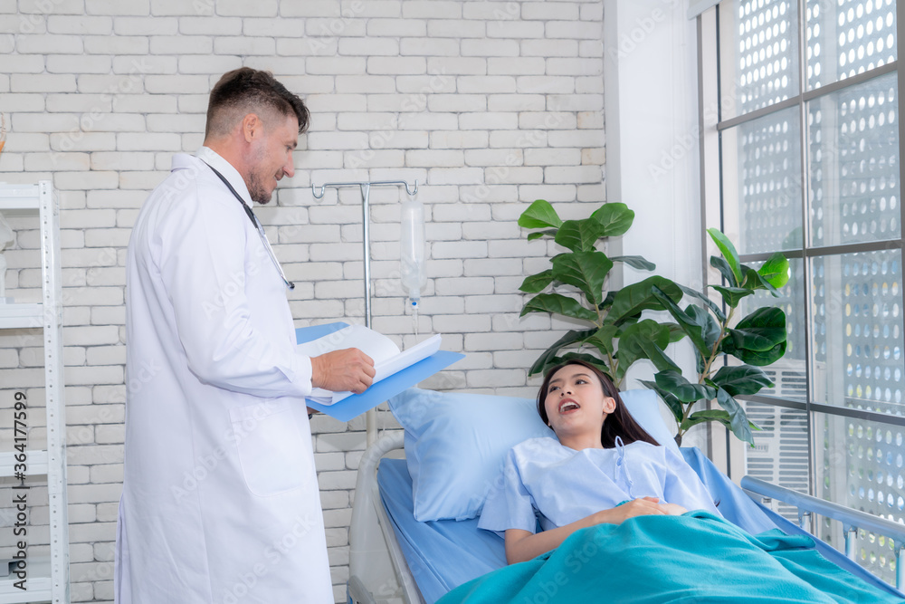 Doctor in professional uniform examining patient at hospital or medical clinic. Health care , medica