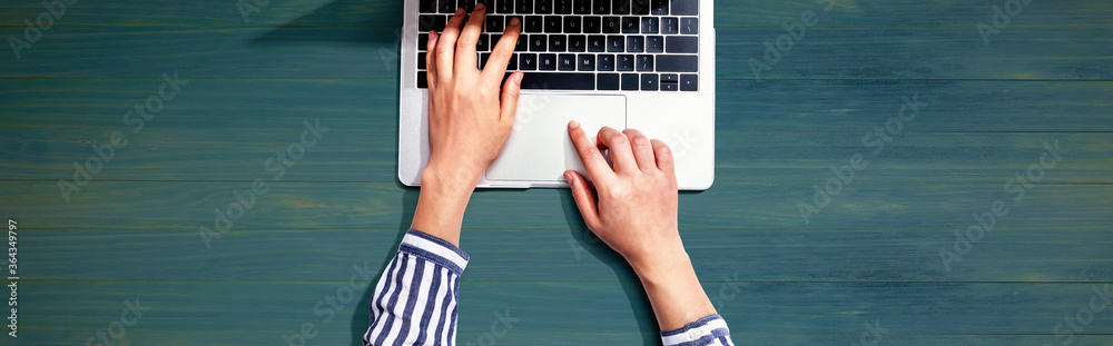 Person using a laptop computer from above