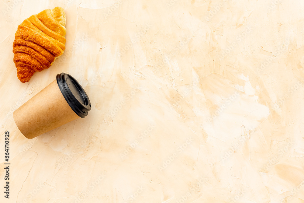 Coffee and croissants on stone table top view