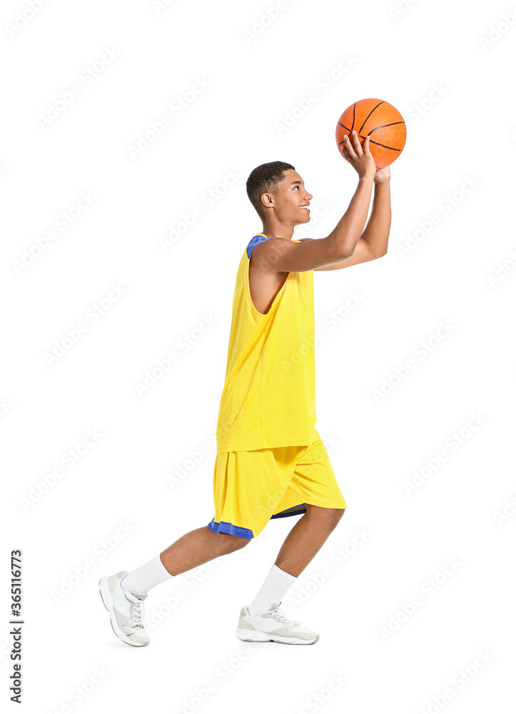 Young African-American basketball player on white background