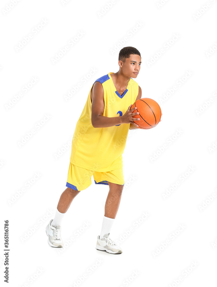 Young African-American basketball player on white background