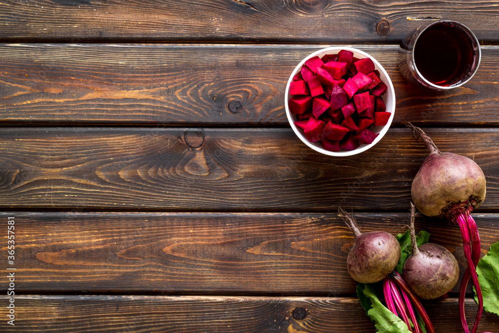 Top view of beet harvest. Green tops, slices, juice top-down space for text