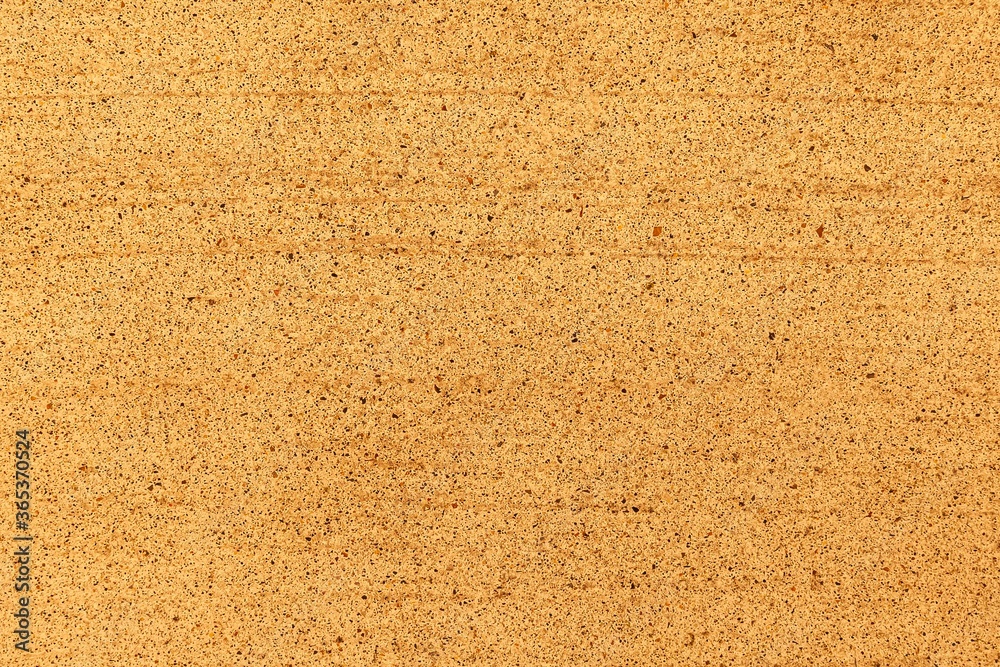 Yellow natural stone texture and seamless background