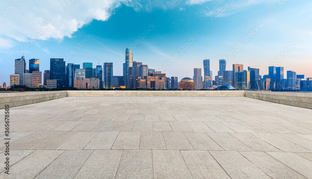 Hangzhou city skyline and commercial buildings with empty square floor,China.