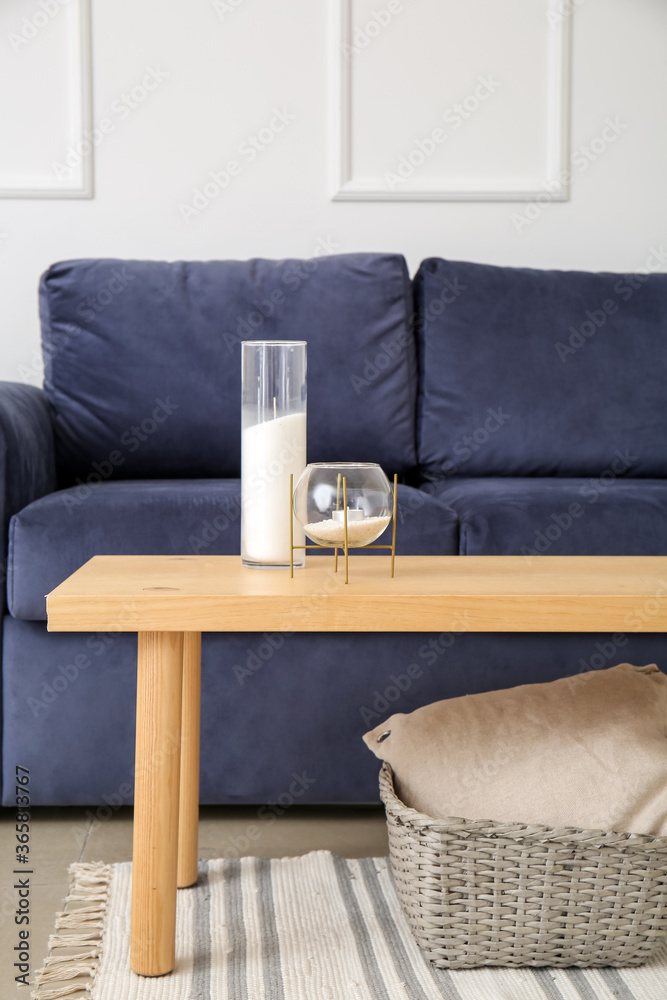 Stylish interior of living room with sofa and table