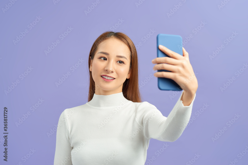 a beautiful girl taking selfie