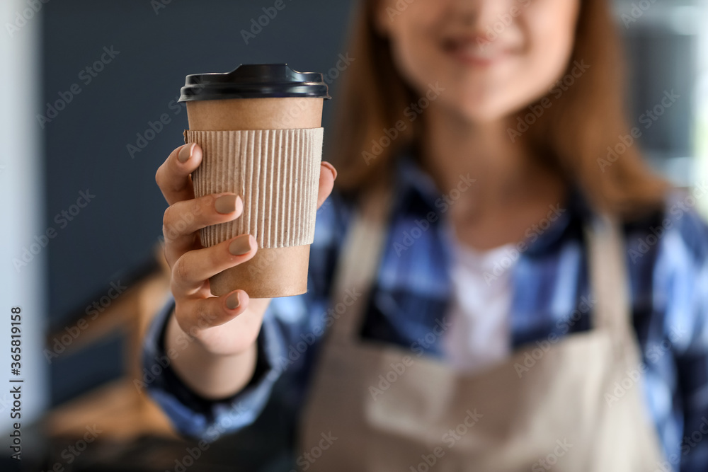 Female barista in modern cafe, closeup