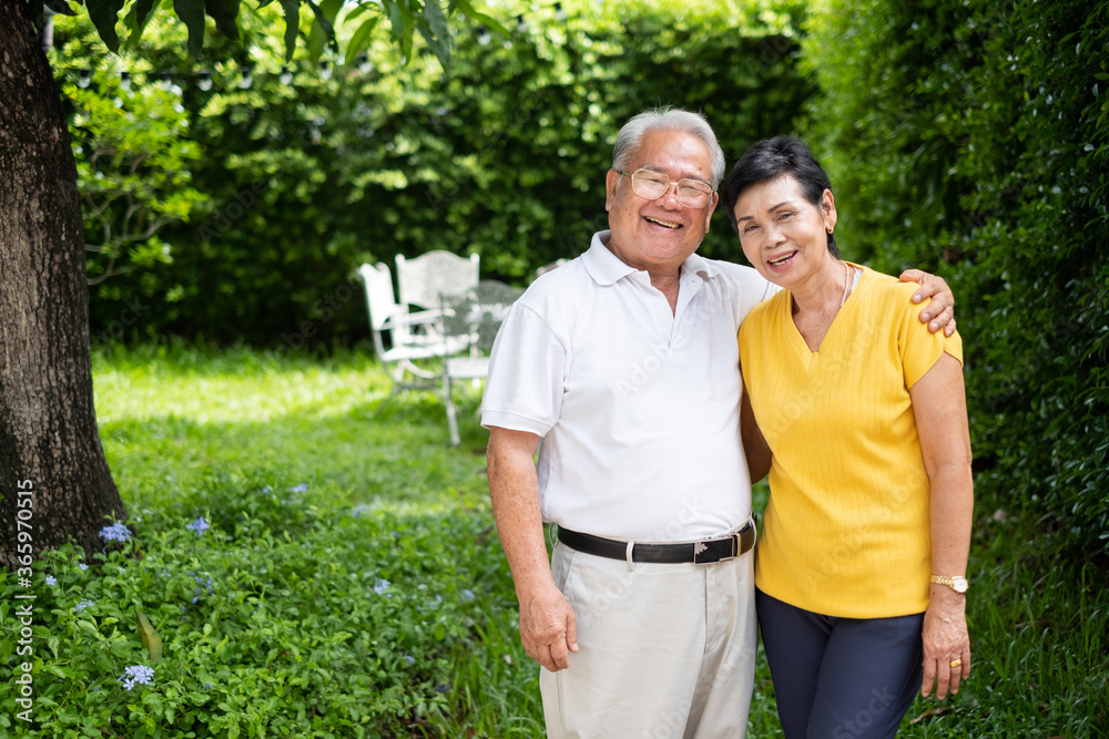 Portrait happy Asian senior couple smiling and laughing at home