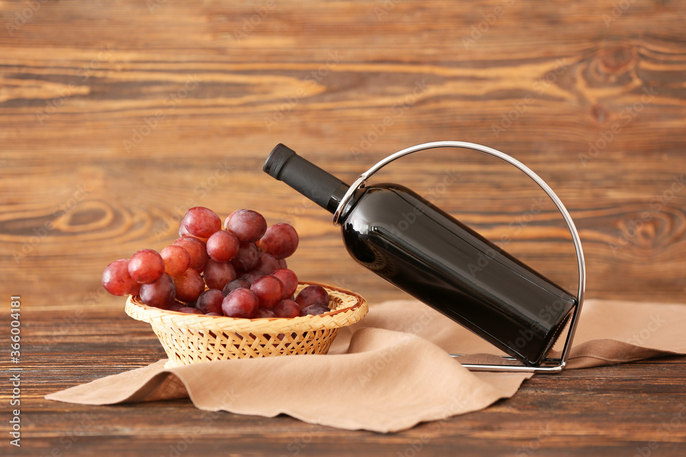 Holder with bottle of wine on table