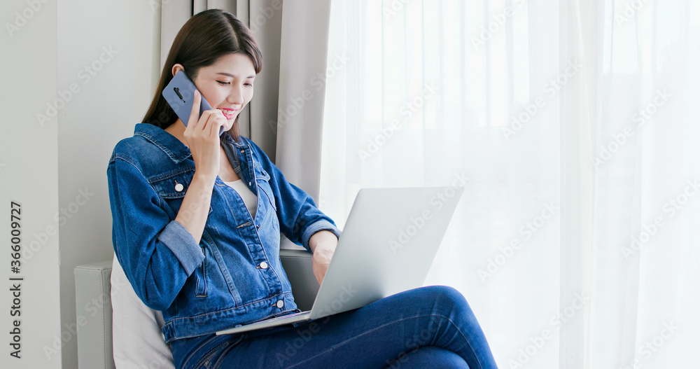 woman use smartphone and laptop