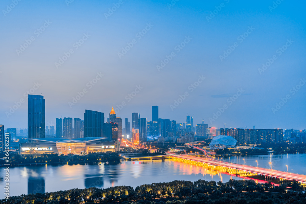 Night view of Shengjing Theater and urban buildings along the Hun River in Shenyang, Liaoning, China