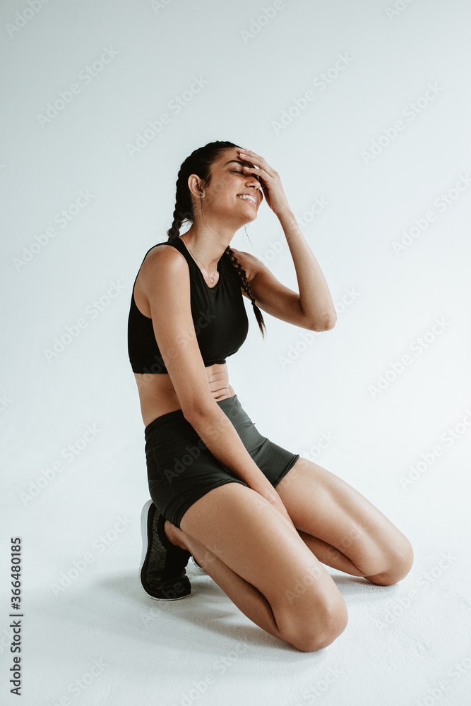 Fitness woman relaxing after exercising