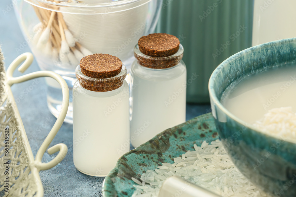 Bottles of rice water on table