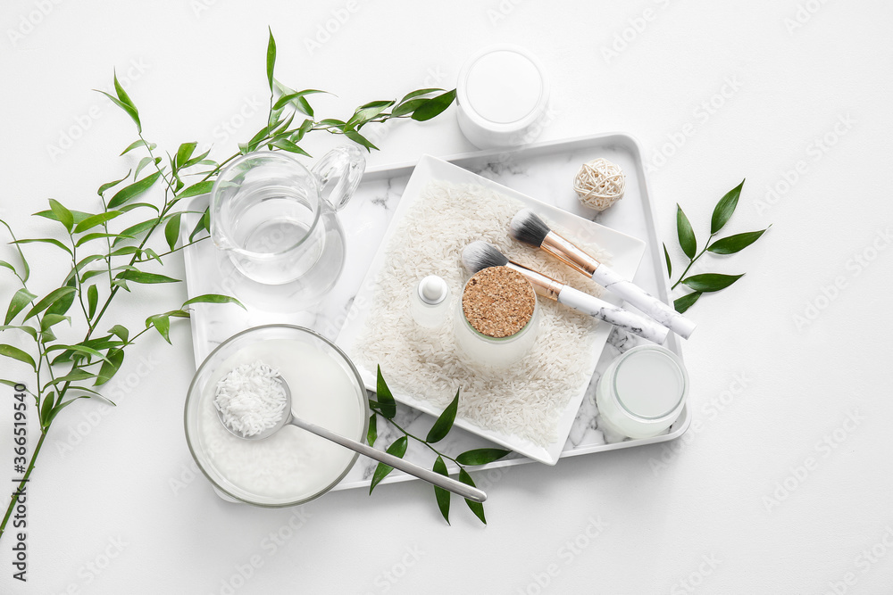 Composition with healthy rice water on white background