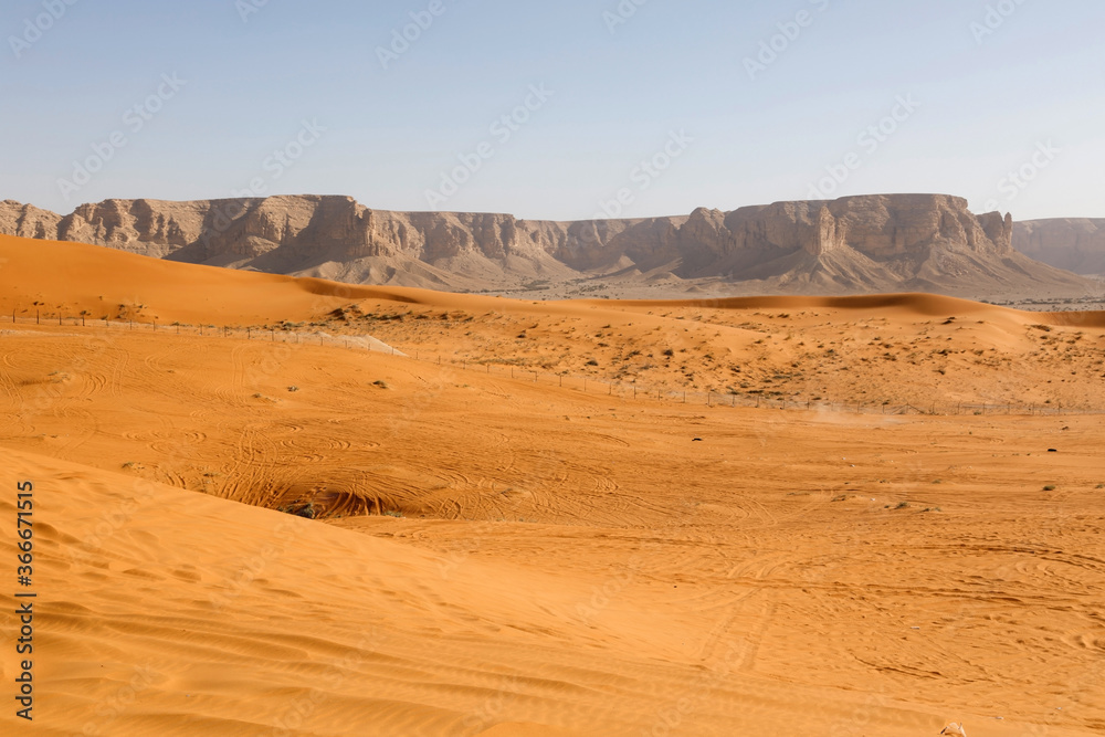 Red sand dunes called Red Sands south of Riyadh. You can see the lanes of quads because the dunes ar