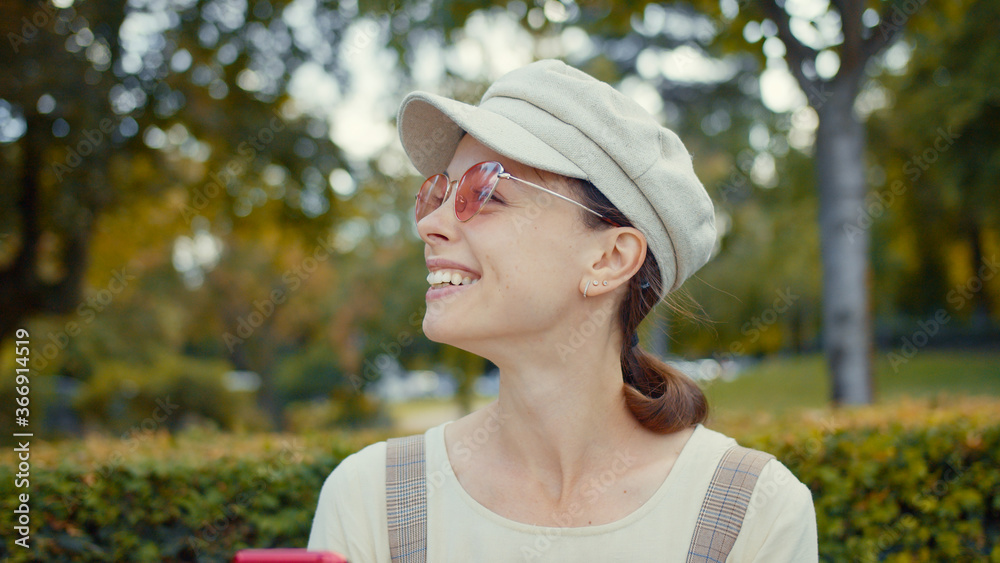 Smiling girl in a park in Paris