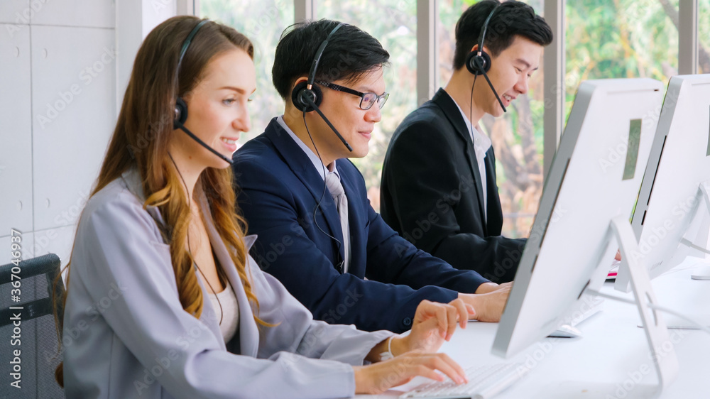 Business people wearing headset working in office to support remote customer or colleague. Call cent