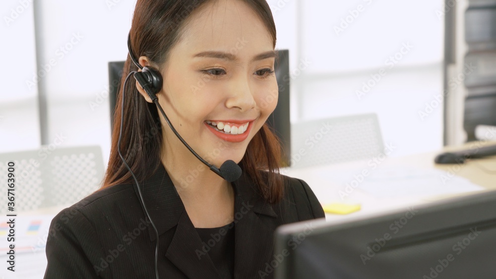 Business people wearing headset working in office to support remote customer or colleague. Call cent