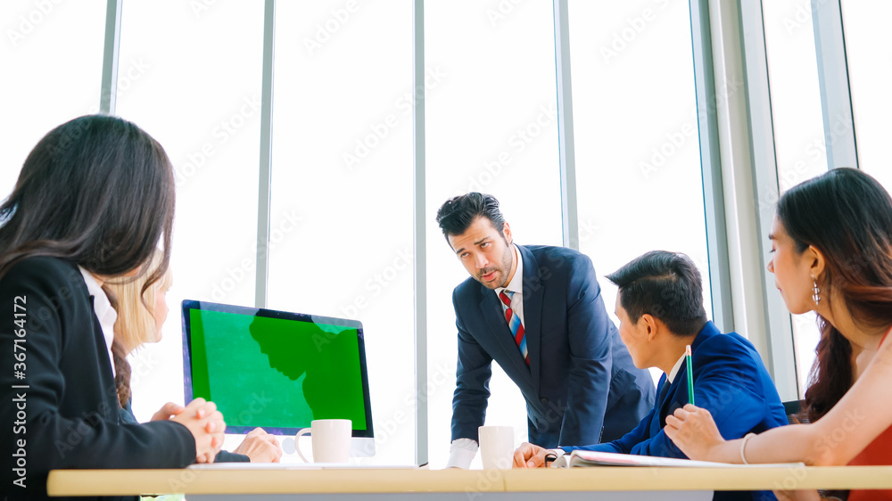 Business people in the conference room with green screen chroma key TV or computer on the office tab