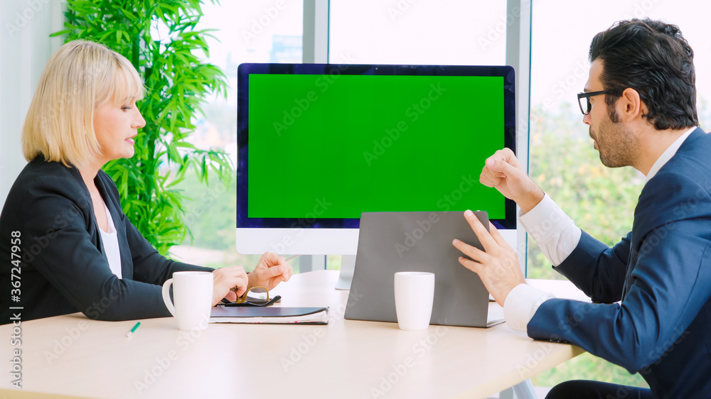 Business people in the conference room with green screen chroma key TV or computer on the office tab