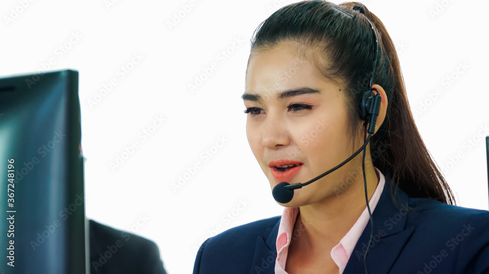 Business people wearing headset working in office to support remote customer or colleague. Call cent