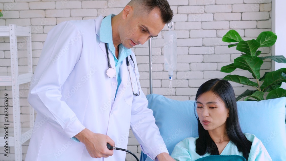 Doctor in professional uniform examining patient at hospital or medical clinic. Health care , medica