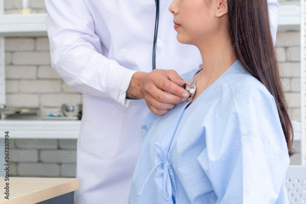 Doctor in professional uniform examining patient at hospital or medical clinic. Health care , medica