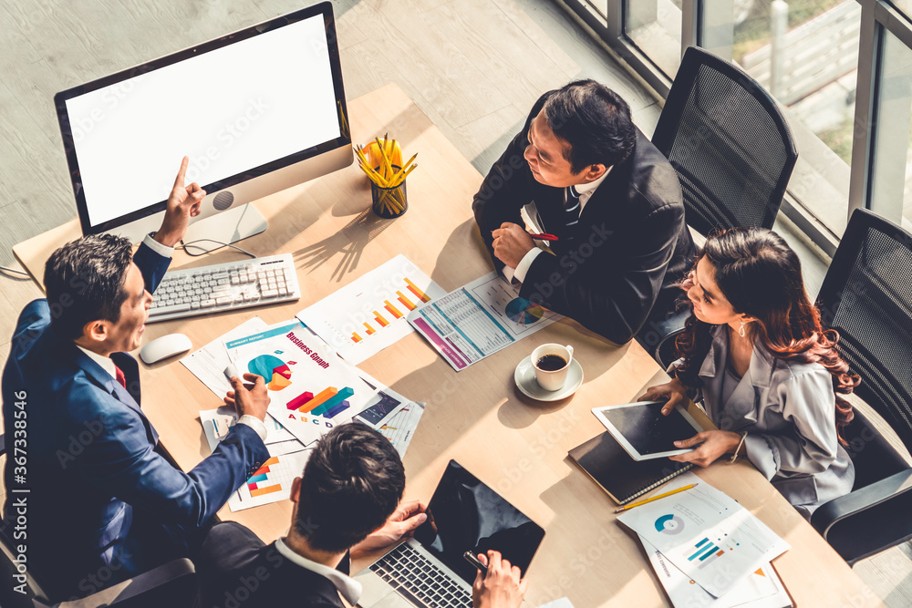 Smart businessman and businesswoman talking discussion in group meeting at office table in a modern 