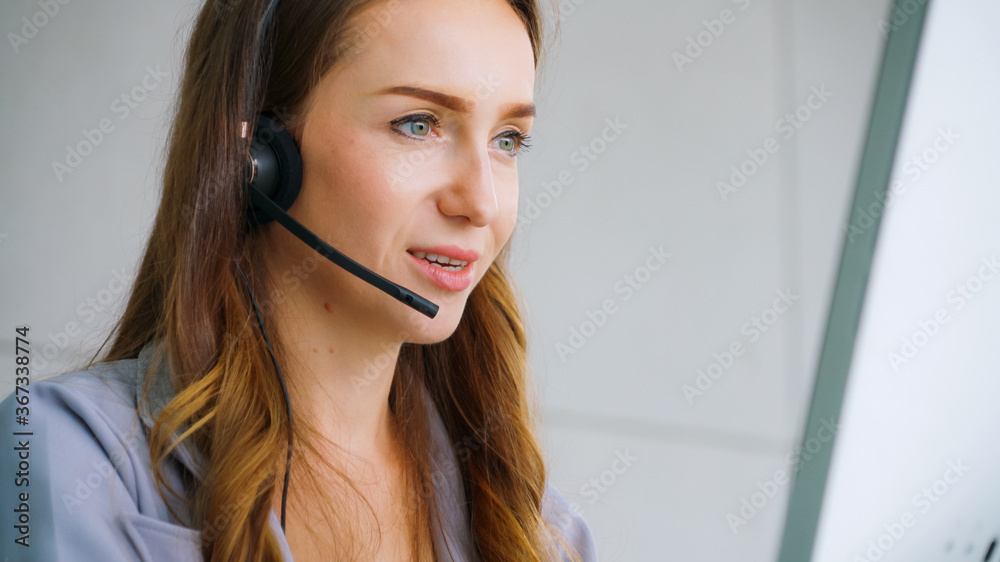 Business people wearing headset working in office to support remote customer or colleague. Call cent