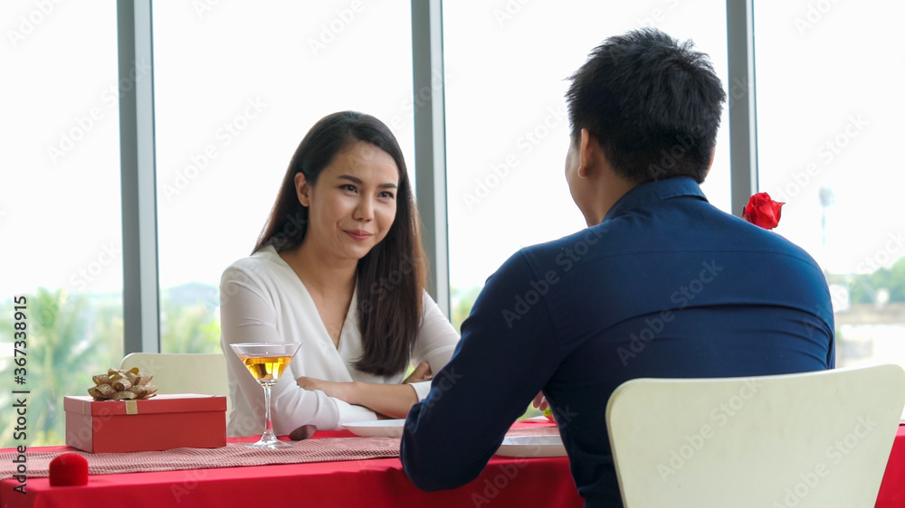 Happy romantic couple eating lunch at restaurant . Couple anniversary celebration and lifestyle .